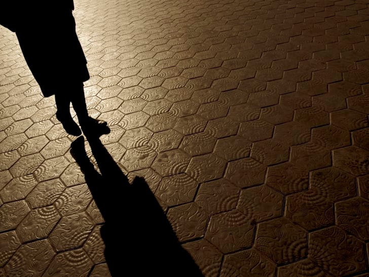 Silhouette of one person walking.